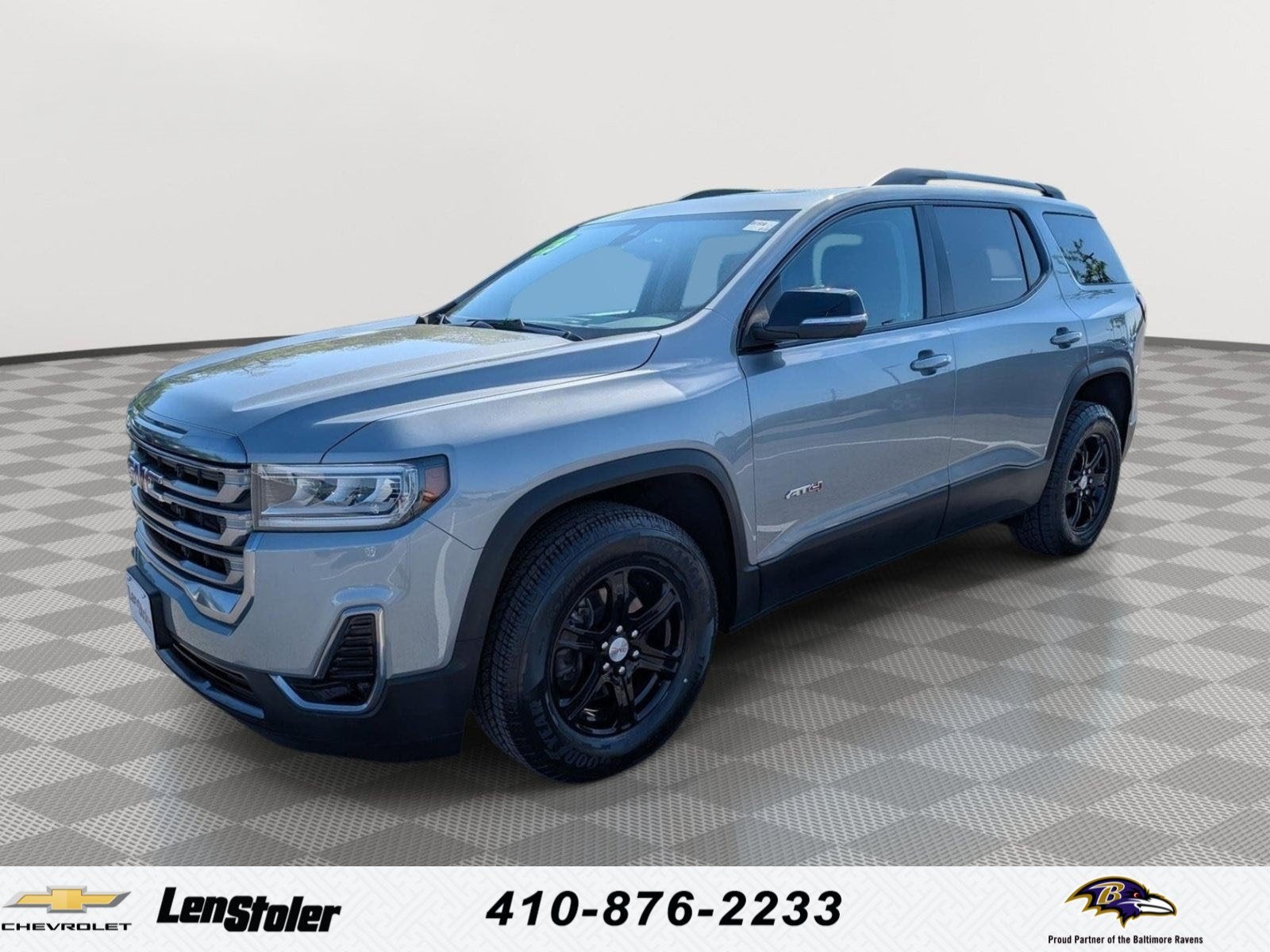 2023 GMC Acadia AT4 in Sterling Metallic — front three-quarter view