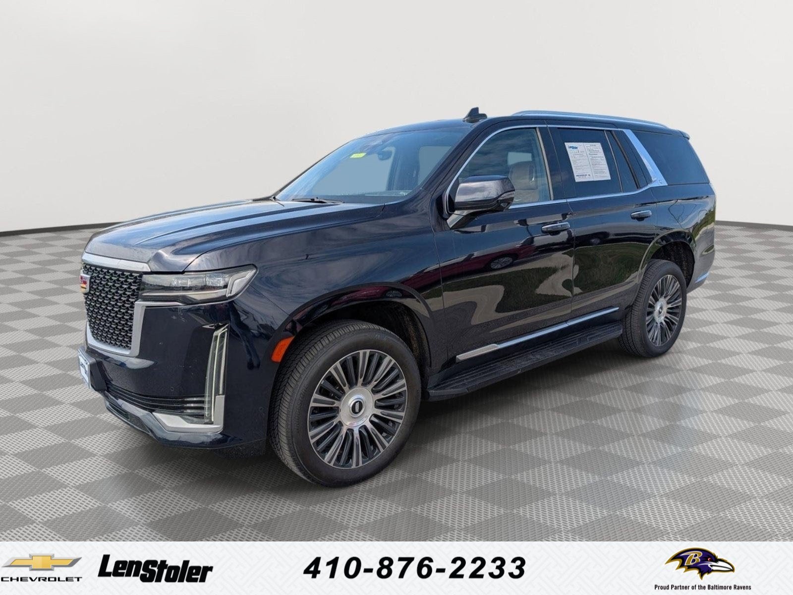 2022 Cadillac Escalade Premium Luxury in Dark Moon Blue Metallic — front three-quarter view