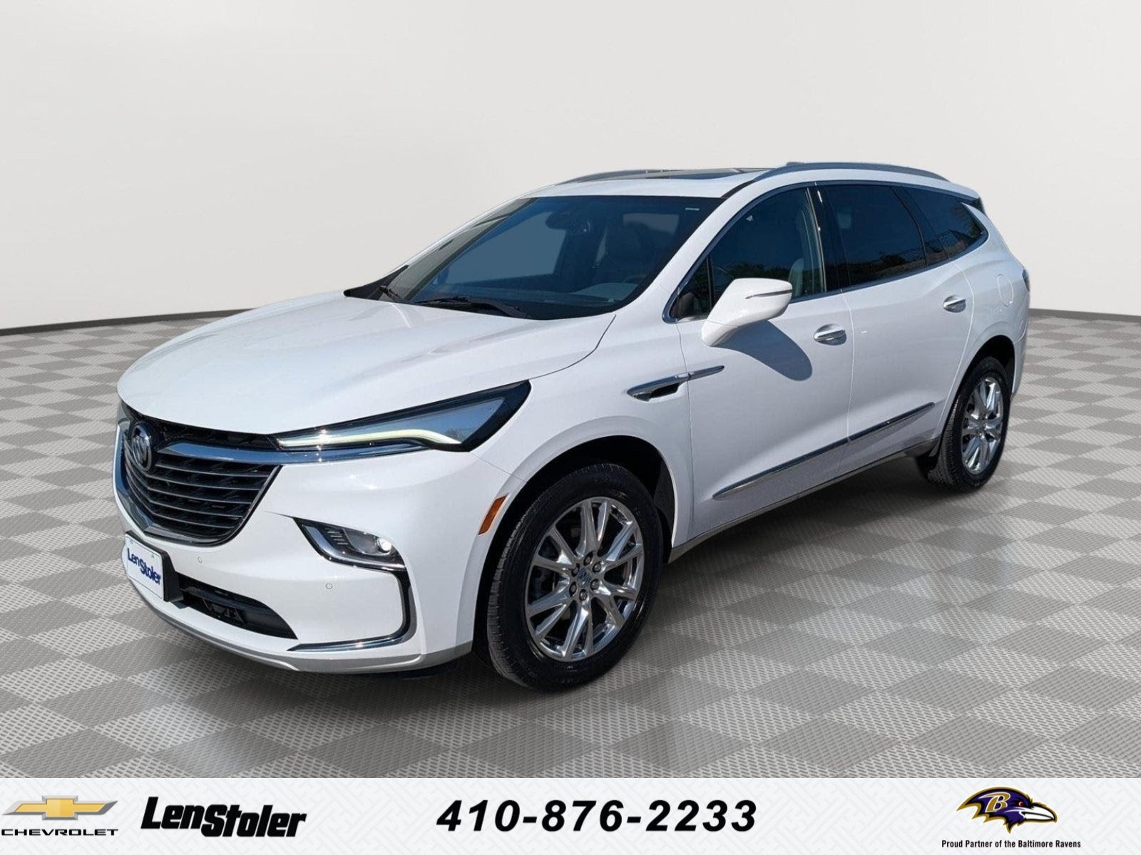 2023 Buick Enclave Essence in Summit White — front three-quarter view
