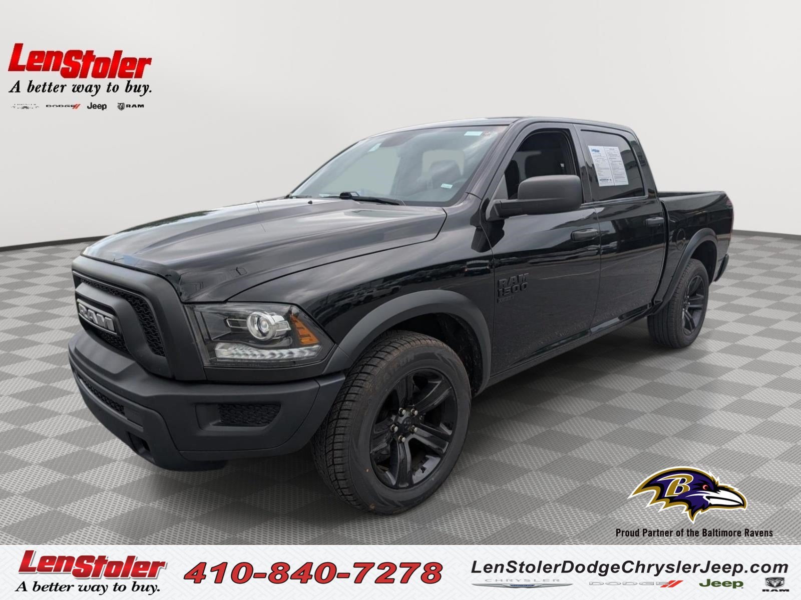 2024 RAM 1500 Classic Warlock in Diamond Black Crystal Pearlcoat — front three-quarter view