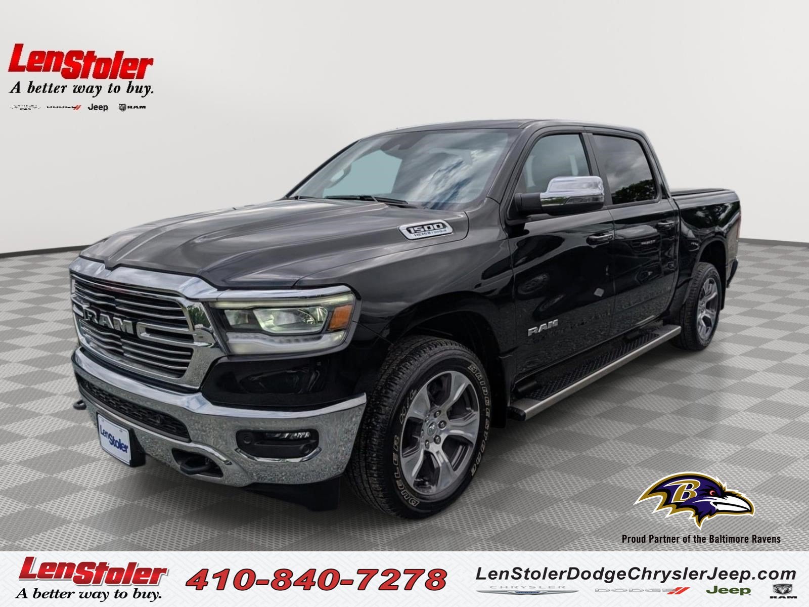 2023 RAM 1500 Laramie in Diamond Black Crystal Pearlcoat — front three-quarter view