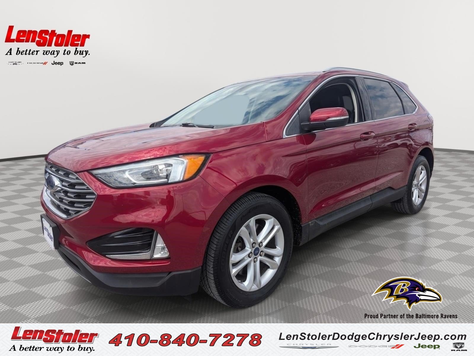 2019 Ford Edge SEL in Ruby Red Metallic Tinted Clearcoat — front three-quarter view