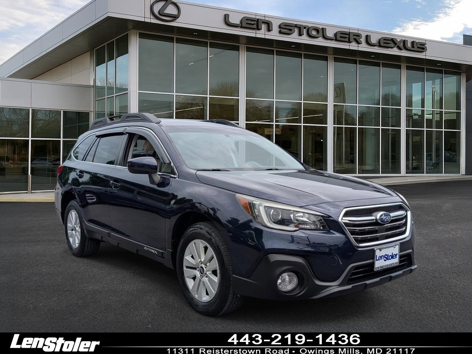2018 Subaru Outback Premium in Dark Blue Pearl — front three-quarter view