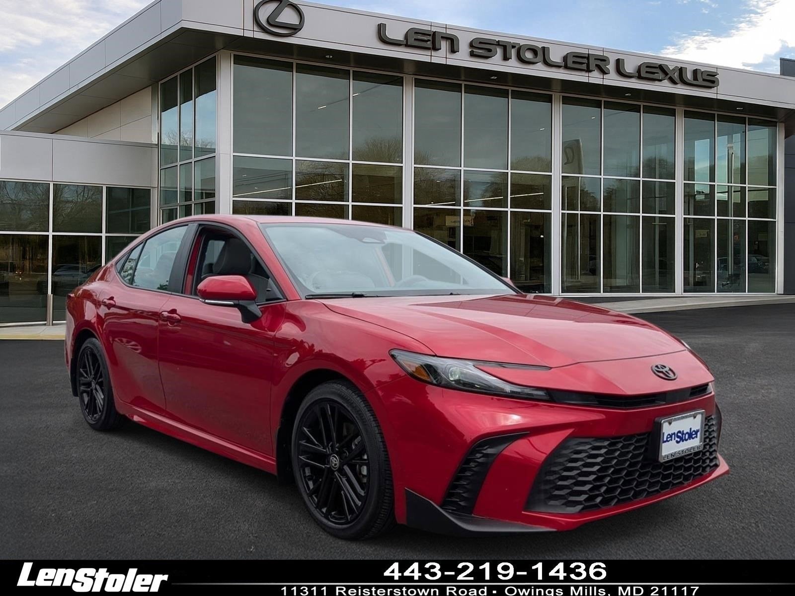 2025 Toyota Camry SE in Supersonic Red — front three-quarter view