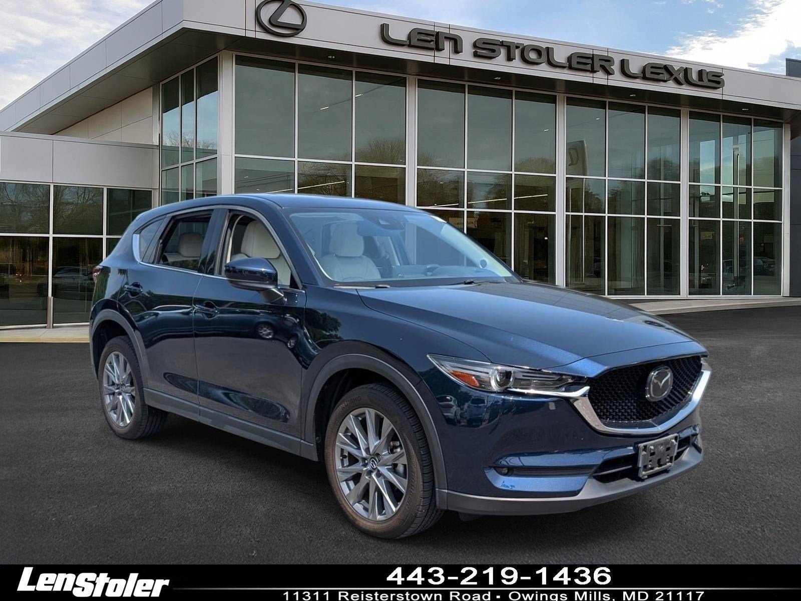 2021 Mazda Mazda CX-5 Grand Touring in Deep Crystal Blue Mica — front three-quarter view