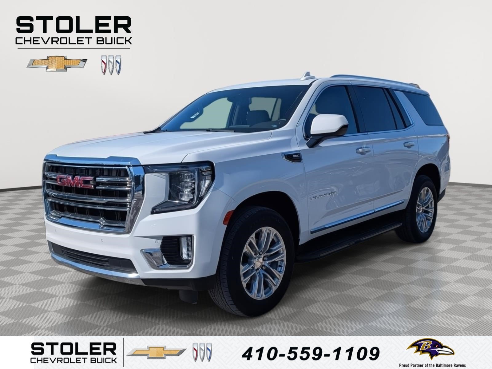 2024 GMC Yukon SLT in Summit White — front three-quarter view