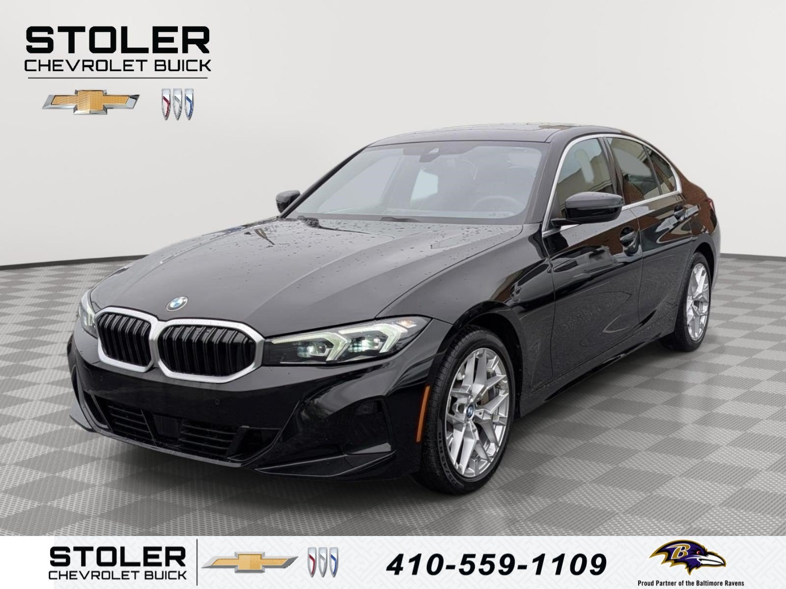 2025 BMW 3 Series 330i xDrive in Jet Black — front three-quarter view